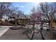 Playground with swings, picnic tables, play structures, and shade coverings for children at 2305 Flower Spring St, Las Vegas, NV 89134