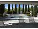 View of the backyard pool and landscaped garden from covered patio at 2305 Flower Spring St, Las Vegas, NV 89134