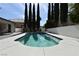 Outdoor swimming pool surrounded by lush landscaping and brick pavers at 2305 Flower Spring St, Las Vegas, NV 89134