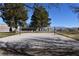 Sand volleyball court surrounded by greenery in The Trails Park at 2305 Flower Spring St, Las Vegas, NV 89134