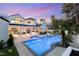 Beautiful outdoor living space with a pool, spa, and covered patio, perfect for enjoying the warm weather at 2316 Prometheus Ct, Henderson, NV 89074