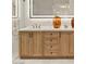 Bathroom vanity with wood cabinets, black hardware, marble countertop, and vessel sink at 2316 Prometheus Ct, Henderson, NV 89074