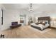 Spacious bedroom featuring a vaulted ceiling, modern lighting, and ensuite bathroom at 2316 Prometheus Ct, Henderson, NV 89074