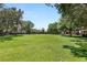 Large open grassy area in the community with mature trees and landscaping in the background at 2316 Prometheus Ct, Henderson, NV 89074