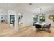Bright dining area features wood floors, a modern light fixture, and plenty of natural light at 2316 Prometheus Ct, Henderson, NV 89074