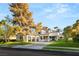 Stunning home featuring a manicured lawn, mature trees, and a three-car garage at 2316 Prometheus Ct, Henderson, NV 89074
