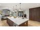 This open-concept kitchen features a large island with seating, great appliances, and plenty of light at 2316 Prometheus Ct, Henderson, NV 89074