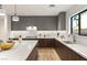 Modern kitchen features a large island with marble countertops, stainless steel appliances, and bright lighting at 2316 Prometheus Ct, Henderson, NV 89074