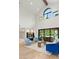 Elegant living room featuring a wine cellar and large windows with backyard pool views at 2316 Prometheus Ct, Henderson, NV 89074