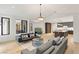 Open concept living room flowing into a modern kitchen with island seating at 2316 Prometheus Ct, Henderson, NV 89074