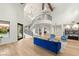 Spacious living room with high ceilings, spiral staircase, and light hardwood flooring at 2316 Prometheus Ct, Henderson, NV 89074