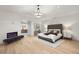 Bright main bedroom featuring a fireplace, wood floors and a luxurious ensuite bathroom at 2316 Prometheus Ct, Henderson, NV 89074