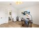 Bright home office with hardwood floors, modern decor, and an ensuite bathroom at 2316 Prometheus Ct, Henderson, NV 89074