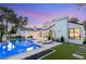 Stunning backyard with a sparkling pool, lounge chairs, and lush landscaping, perfect for enjoying the outdoors at 2316 Prometheus Ct, Henderson, NV 89074