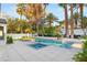Relaxing pool and spa with ample room for leisure, enhanced by mature palm trees at 2316 Prometheus Ct, Henderson, NV 89074