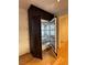 Modern refrigerator with wood paneling and stainless steel interior and hardware at 2316 Prometheus Ct, Henderson, NV 89074