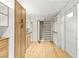 Spacious walk-in closet featuring hardwood floors and custom shelving and drawers at 2316 Prometheus Ct, Henderson, NV 89074