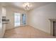 Dining area featuring sliding glass doors to the backyard and a decorative fireplace at 2501 Muirfield Ave, Henderson, NV 89074