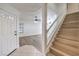 Inviting entryway with wood-look floors, stairs, and abundant natural light at 2501 Muirfield Ave, Henderson, NV 89074