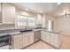 Bright kitchen featuring modern appliances, granite countertops, and ample counter space at 2501 Muirfield Ave, Henderson, NV 89074