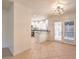 Open floor plan leading to the bright kitchen and dining area with backyard access at 2501 Muirfield Ave, Henderson, NV 89074