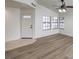 Bright living room with new flooring, vaulted ceiling and a light color scheme, creating a welcoming atmosphere at 2501 Muirfield Ave, Henderson, NV 89074