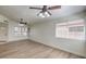 Spacious living room with modern flooring, a fan, and neutral walls creating a clean and bright space at 2501 Muirfield Ave, Henderson, NV 89074