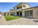 Large backyard featuring green space, pavers, and sliding door access to the house at 253 Malpaso St, Las Vegas, NV 89138