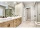 Modern bathroom featuring double sink vanity, sleek fixtures, and a glass-enclosed shower with stylish tile work at 253 Malpaso St, Las Vegas, NV 89138