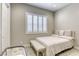 Serene bedroom featuring a comfortable bed, neutral colors, and a window with plantation shutters, offering a relaxing retreat at 253 Malpaso St, Las Vegas, NV 89138