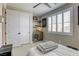 Comfortable bedroom with white bedding, natural light and convenient beverage cooler at 253 Malpaso St, Las Vegas, NV 89138