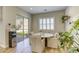Bright breakfast nook with table, chairs, and large window overlooking the backyard at 253 Malpaso St, Las Vegas, NV 89138