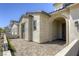 Inviting front entrance featuring a covered porch, stone accents, and a paved walkway leading to the front door at 253 Malpaso St, Las Vegas, NV 89138