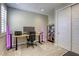 Well-lit home office with adjustable desk, modern lighting and ample storage at 253 Malpaso St, Las Vegas, NV 89138