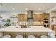 Well-equipped kitchen boasting stainless steel appliances, ample counter space, and a functional center island at 253 Malpaso St, Las Vegas, NV 89138