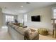 Spacious upstairs living room with sectional sofa and an exercise bike at 253 Malpaso St, Las Vegas, NV 89138