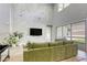 Living room with a painted accent wall, providing backyard views and access at 253 Malpaso St, Las Vegas, NV 89138