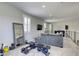 Second-story living area with exercise equipment and modern sectional sofa at 253 Malpaso St, Las Vegas, NV 89138