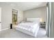 Calm main bedroom featuring a modern bed frame, soft carpet, and ensuite bathroom at 253 Malpaso St, Las Vegas, NV 89138