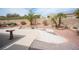 This charming backyard features drought-resistant landscaping and a low brick wall at 2737 Tumble Brook Dr, Las Vegas, NV 89134