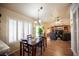 The dining room gets plenty of natural light and connects to the living room at 2737 Tumble Brook Dr, Las Vegas, NV 89134