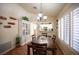 The dining area showcases natural light with clear views of the bright and modern kitchen at 2737 Tumble Brook Dr, Las Vegas, NV 89134