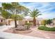 Attractive single-story home with a two car garage, tile roof, mature trees, and desert landscaping at 2737 Tumble Brook Dr, Las Vegas, NV 89134