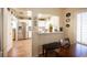 Bright kitchen and breakfast nook with white cabinets, stainless steel appliances, and skylights at 2737 Tumble Brook Dr, Las Vegas, NV 89134