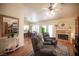 Inviting living room featuring wood floors, neutral colors, and a cozy fireplace at 2737 Tumble Brook Dr, Las Vegas, NV 89134