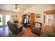 The living room has ample seating and a cozy atmosphere enhanced by the fireplace at 2737 Tumble Brook Dr, Las Vegas, NV 89134