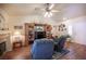 Comfortable living room showcasing a vaulted ceiling, fireplace, and built-in shelves at 2737 Tumble Brook Dr, Las Vegas, NV 89134