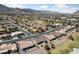 Scenic aerial view of a desert community, highlighting the golf course, mountain views, and serene neighborhood setting at 3016 High Range Dr, Las Vegas, NV 89134