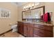 Bathroom featuring wood cabinets, a marble countertop, and neutral paint at 3016 High Range Dr, Las Vegas, NV 89134