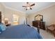 This bedroom features carpeted floors, crown molding, and a ceiling fan at 3016 High Range Dr, Las Vegas, NV 89134